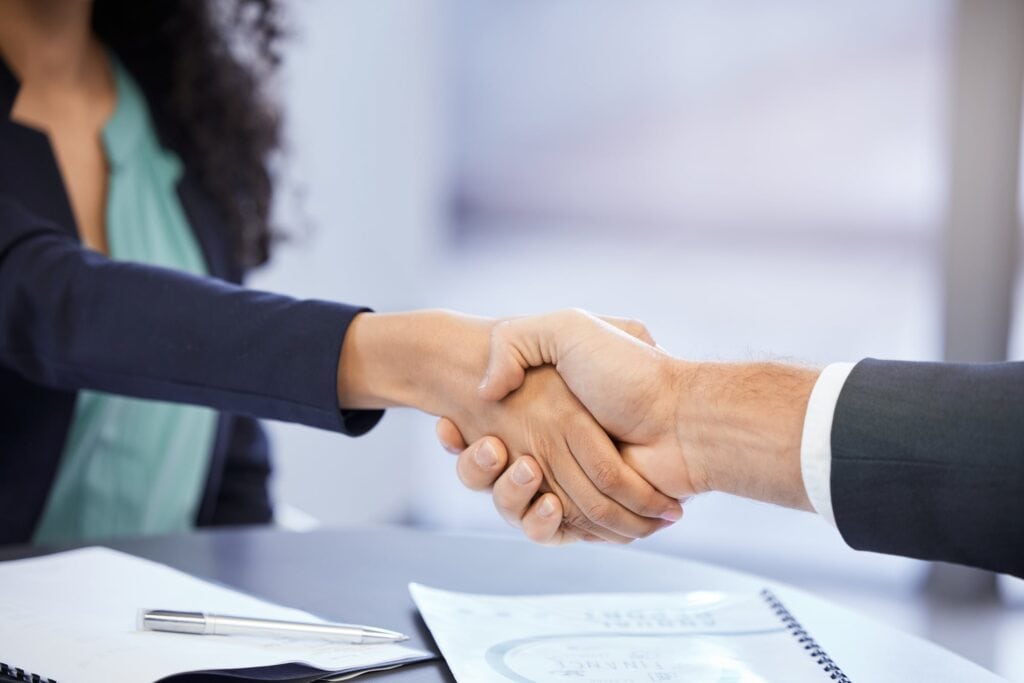 A client and a real estate agent closing the deal.